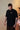 Camiseta The Trunk — detalhe da gola e acabamento premium